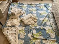 Full view of both airplane-themed bedding sets laid out, including duvet covers, sheet sets, pillowcases, and throw pillow covers.