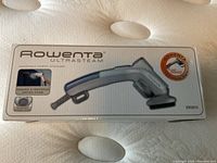 Front view of Rowenta Ultrasteam handheld fabric steamer box highlighting product name, image, and key feature of powerful, continuous vertical steam.