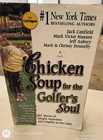 Front cover of the book 'Chicken Soup for the Golfer's Soul' showing golfer and author names