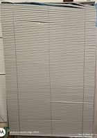 Photo showing the grey horizontal cordless Venetian blinds fully lowered, capturing the overall condition and design