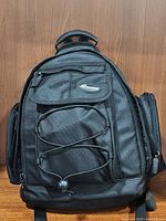 Front view of black Promate camera backpack