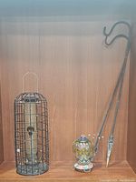 Full lot overview showing tube feeder, blown glass hummingbird feeder, and pair of shepherd's hooks