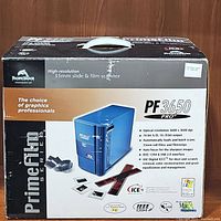 Front of the product box showing PrimeFilm PF 3650 Pro high-resolution 35mm slide & film scanner with product image and key features.