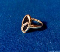 Ring angled view showing onyx center and diamond accents