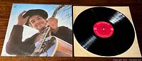 Photo of Bob Dylan Nashville Skyline vinyl album cover and vinyl record with Columbia label.