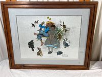 Full view of framed Norman Rockwell print showing entire artwork and frame.