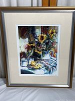 Full image of framed floral lithograph print showing flowers, lemon, and ceramics on a table