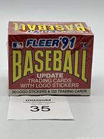 Photo of sealed box of 1991 Fleer Baseball Update trading cards wrapped in original plastic shrink wrap showing branding and product details on front.
