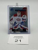Front view of 2015-16 Upper Deck SP Game Used Authentic Rookies hockey card featuring Mike Condon, showing his image, autograph, and branding details.