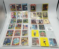 Full lot of assorted non-sports cards arranged in protective sleeves. Includes Star Wars and cartoon/comic style cards with diverse colorful designs.