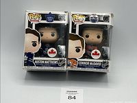 Both Funko Pop figures in original boxes side by side showing Connor McDavid and Auston Matthews NHL hockey player designs.