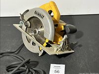 Side angled view of Dewalt DWE575 circular saw showing blade guard, handle, and power cord