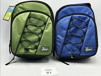 Two insulated lunch bags, one green and one blue, side by side showing front elastic cord and zipper detail.