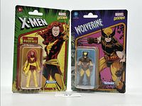 Two Kenner Marvel Legends figures, Dark Phoenix and Wolverine, in original blister card packaging with classic comic-style artwork.