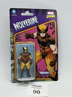 Front view of sealed Marvel Legends Wolverine figure in blister packaging showing detailed figure and comic art card