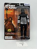 Front view of first General Ursus action figure in sealed blister pack with Statue of Liberty backdrop and Planet Of The Apes branding.
