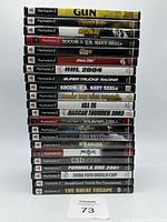 Stack of 22 PlayStation 2 game cases showing cover art titles including GUN, Rogue Ops, The Getaway, SOCOM 3, and others.