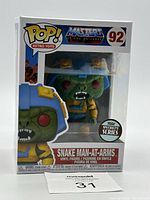 Front view of the Snake Man-at-Arms Funko Pop box showing figure inside with Master of the Universe and Pop! Retro Toys branding, figure number 92.