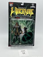 Front view of sealed Nottingham Witchblade action figure packaging showing figure, sword, Witchblade, and display stand