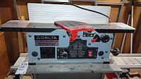 Front view of Delta jointer/planer showing control panel and infeed table