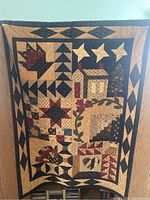 Full view of the quilt showing overall patchwork designs and border