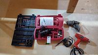Full lot view showing Craftsman rotary tool in open case with accessory bits, soldering iron, hot glue gun, and heat applicator.