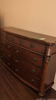Front view of bowfront dresser showing all drawers and overall condition