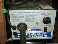 Front view of Mastercraft Wire Feed Arc Welder model 117-032 B showing control selector and label
