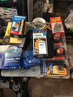 Overview of various drill bit sets, packs and accessories laid out on a surface including Mastercraft and Maxxold sets