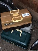 Three stacked plastic tackle boxes