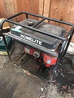 Side view of Homelite generator showing the frame, fuel tank, and engine placement.