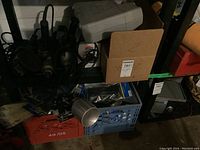 Photo of shelving with various tools and boxed items.