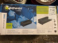 Top and front view of the Xantrex Xpower 1500 power inverter box, showing branding, 1500 watt power rating, and usage information.