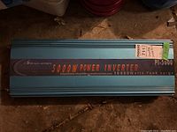 Top view of power inverter showing full label with brand Power Jack, model PI-5000, and power ratings 5000W continuous, 10000 watts peak surge.