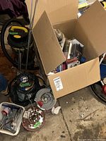 General shot showing Stanley wet/dry vac, rope spools, and box containing tools