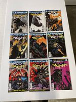 Nine Batman comic books arranged on a white surface, showing various cover arts including Annuals and issues 1, 2, 4 from the Rebirth series.