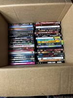 Top view of box containing 36 DVDs showing titles and arrangement