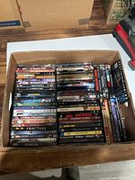 Box of various DVDs shown from top, with titles visible on spines