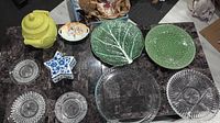 Overview of assorted serving dishes on marble table