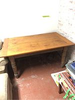 Full view of pine table showing turned legs and overall shape