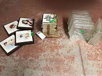 Overview of all tile sets including Limoges painted tiles, tree-painted tiles stacked, and clear glass tiles.