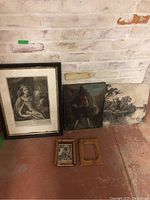 Overview of six items including framed Mary Queen of Scots print, smaller framed print, two unframed paintings, and two empty wooden frames.