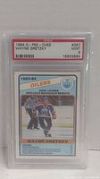 Front of the 1984 O-Pee-Chee Wayne Gretzky hockey card graded PSA 9 showing the player skating with the Edmonton Oilers logo and stats.