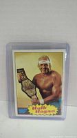 Front view of vintage 1985 Hulk Hogan rookie card with WWF logo and championship belt image.