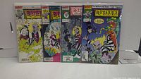 Lot of four Beetlejuice comics displayed side by side showing front cover art