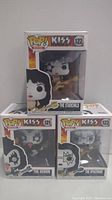 Photo of all three KISS Funko Pop! Rocks figures in original sealed boxes: The Starchild #122, The Demon #121, and The Spaceman #123.