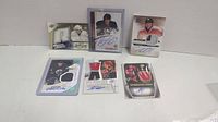 Full lot of six autographed rookie hockey cards with player-worn and game-worn jersey patches.