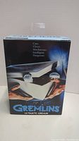 Front of the unopened Gremlins Ultimate Gremlin action figure box showing movie artwork and branding.
