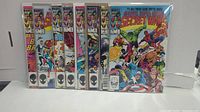 Front view of the 8 Marvel Secret Wars comics in protective sleeves showing the spines and partial covers.