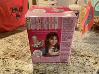 Front view of the Lil Chefs Ice Cream Maker box showing product name, age recommendation, picture of the product and a smiling child.